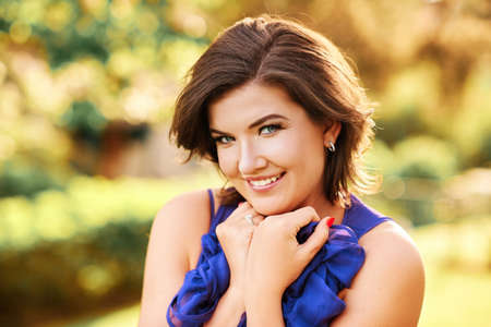 Close up portrait of beautiful charming woman with short haircutの写真素材