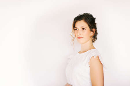 Tender portrait of romantic young girl wearing lace dress