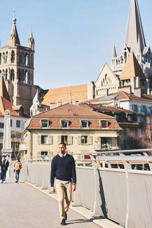 Outdoor portrait of handsom African American man walking down the street, image taken at Pont BessiÃ¨res, Lausanne, Switzerlandの写真素材