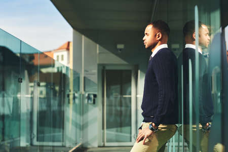 Urban portrait of African American male model posing outsideの写真素材
