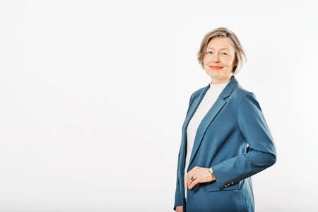 Studio portrait of middle age woman posing on white background