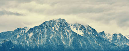 Panoramic banner landscape alpine mountain under first snow