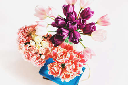 Variety of pink tulip bouquet flowers, top view, spring background