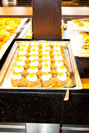 Oriental sweets in a wide range, cakes, baklava, Turkish delight with almonds, cashews and...