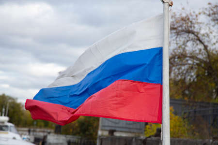 The Russian flag, growing in the wind. Flag of the Russian Federation in the open airの写真素材