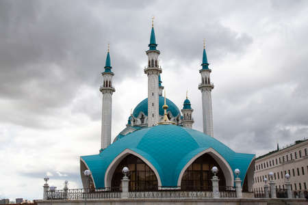 Beautiful white mosque with a blue roof against the sky with clouds. Mosque in Russia in Kazanの写真素材