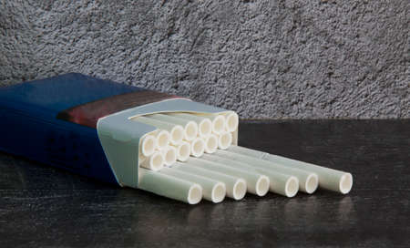 Cigarettes with a white filter in a blue pack it's Time to stop Smoking Addictionの写真素材