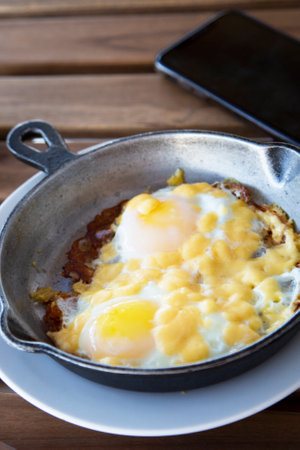 breakfast with eggs. Burnt scrambled eggs. A bachelor's meager breakfast, morningの写真素材