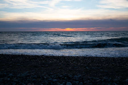 Beautiful sunset above the sea The setting sun over the ocean, in the eveningの写真素材