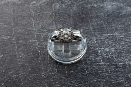Diamond Ring, Gold ring with natural diamonds on a dark background, precious stonesの写真素材