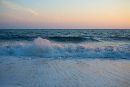 Beautiful view of the panorama and the sea at sunset, summer evening on the ocean