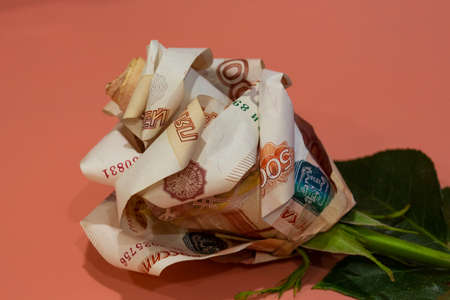 flowers origami banknotes the rose is made of 5000 Russian banknotes. concept-favorite flowers are moneyの写真素材
