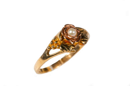 A gold ring with a pearl. Womens jewelry made of yellow gold with beadsの写真素材