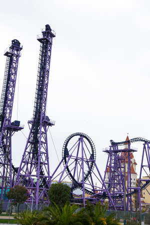 Panoramic view of an empty rollercoaster ride with sharp turns and twists