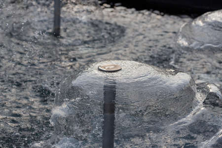 abstract figure of a water fountain on blurred background