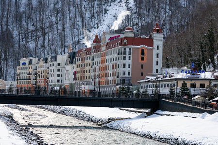 Sochi, Russian Federation - March 17, 2022: The view of the town hall Rosa Khutor, and Mzymta river...