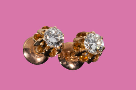 Diamond Earrings Isolated on White Background. Yellow Gold Diamond Earring Pair with 750 Stamp Denoting 18-Carat Yellow Gold.の写真素材