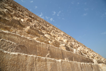 Giza, Egypt Bottom view of the Steep slopes of the Great Pyramid of Khufu, Giza Plateau, Cairo,...