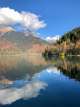 Lake Ritsa panoramic view at sunset. Lake Ritsa is a lake in the Caucasus Mountains in Abkhazia region, Georgia.の写真素材