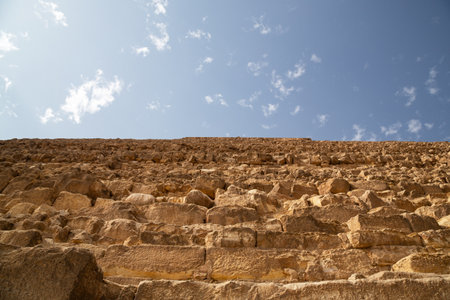 Giza, Egypt Bottom view of the Steep slopes of the Great Pyramid of Khufu, Giza Plateau, Cairo,...