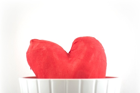 Valentine's hand-made heart in a flower pot over whiteの写真素材