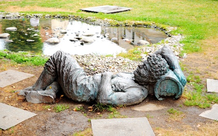 Sculpture of a man sleeping on a tun of wine in South Moravian town of Mikulovの写真素材