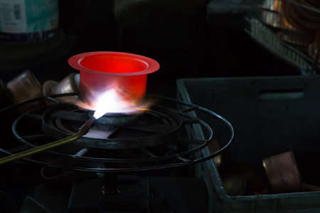 Production of a handcrafted copper potの写真素材