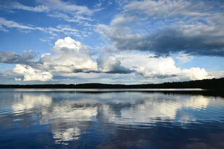 Clouds reflecting on the lakeの写真素材