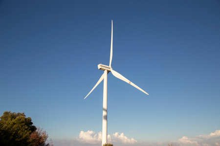 Wind turbines for the production of electricity against the blue sky Ecologically pure energy of...