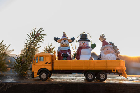 toy childrens cargo truck with souvenir figurines in the back. Holiday card concept.の写真素材