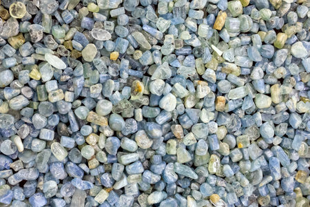 collection of rough and polished colored aquamarine gemstones