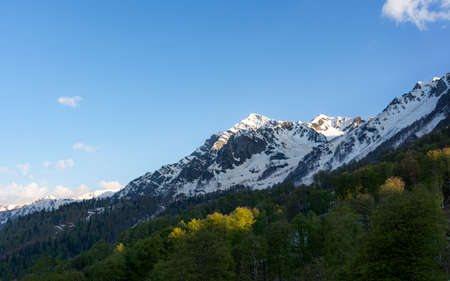 Beautiful snow-capped mountains against the blue sky in Sochi, Krasnodar territory, Krasnaya Polyana...