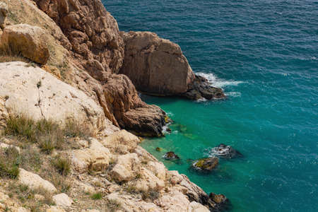 The turquoise sea and cliff top view of the Crimean coast, the tourist season, the trip to the...