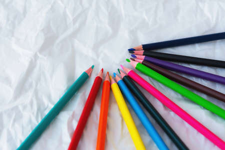Colour pencils isolated on white background close up. Colored pencils on a white background with...