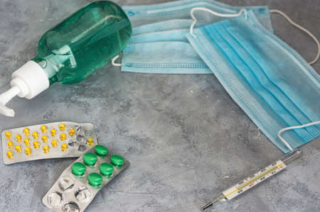 Antiseptic gel and medical masks and tablets. Prevention of coronavirus. Protection from a pandemic....
