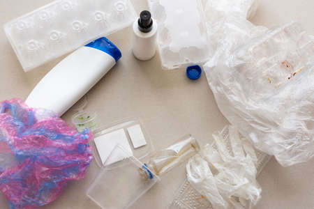 Layout of different plastic garbage top view. Recycling of plastic waste. Separate waste collection. Environmental pollution. Plastic garbage. Caring for the environment on Earth.の写真素材