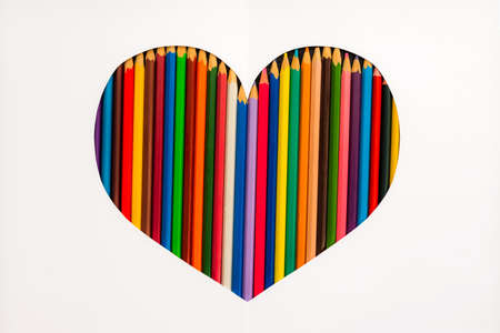 Heart of colored pencils with a white background. The layout of the greeting card. Day of lovers. The concept of love and unity. Creative composition with space for text.の写真素材