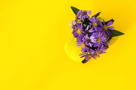 Composition of autumn flowers on the car. The concept of delivery of flower bouquets. Purple...