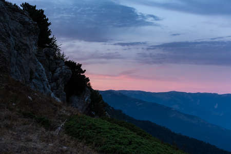 Fantastically beautiful sunset over Yalta from AI-Petri mountain. Autumn mountain landscape. Blue...