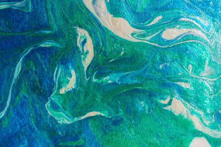 Turquoise blue abstract background in the technique of fluid art. liquid art pattern. Original art....