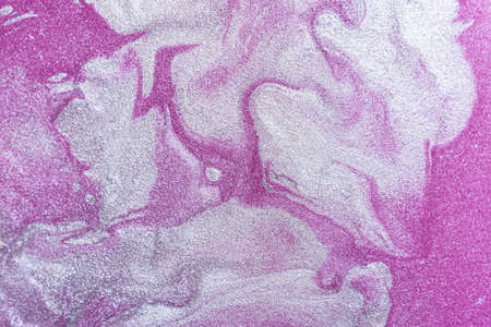Pink-gray abstract shiny art background with acrylic paints. Fluid art texture. Conceptual design of femininity, romance, and festive mood. Modern background of mixed colors for postcards, banners.の写真素材