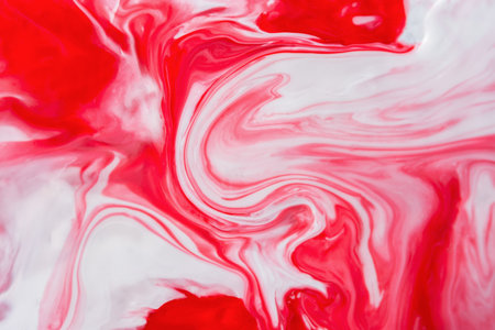 Red and white fluid art, abstract creative background with acrylic paints. Dynamic lines, free movement, outburst of emotions, passion, free natural form. The concept of strawberries with cream.の写真素材