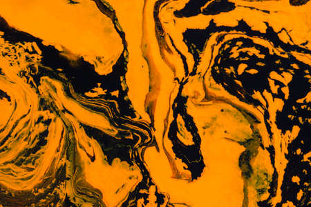 Abstract orange black marble background. Acrylic painting conceptual Halloween. Leopard, tiger art background. The original fragment of the picture. Fashionable background for posters, postcards.の写真素材