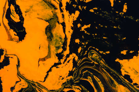 Abstract orange black marble background. Acrylic painting conceptual Halloween. Leopard, tiger art background. The original fragment of the picture. Fashionable background for posters, postcards.の写真素材