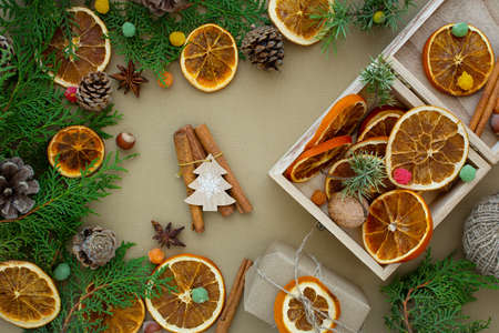 Zero waste Christmas concept. Natural materials wood, paper, fir branches, cones, nuts, dried citrus...
