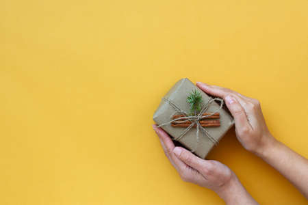 Zero waste Christmas concept. Natural gift materials paper fir branches dried citrus cinnamon on a...
