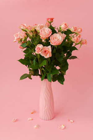 Pink roses pink background. flower arrangement. Delicate bouquet of pink flowers on a pink pastel background. The concept of congratulations, romance. A postcard for Valentine's Day, Mother's Day.の写真素材