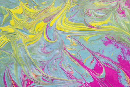 Abstract fluid art texture. A multicolored pictorial fragment of a painting. Bright acrylic drawing of pink, yellow, purple, pale green and blue shades close-up. The concept of summer mood, floweringの写真素材