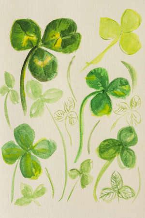 Clover leaves watercolor. Handmade author's illustration from different leaves on watercolor paper. The concept of good luck Patrick's Day. Spring collage. Layout design of a book notebook notepadの写真素材