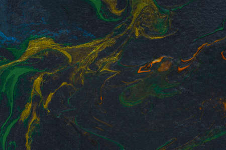 Black orange green fluid art. Abstract acrylic painting background. modern marble texture. The concept of natural texture, creative wave. Fashion art, mockup for booklets, covers, notebooks, bannersの写真素材